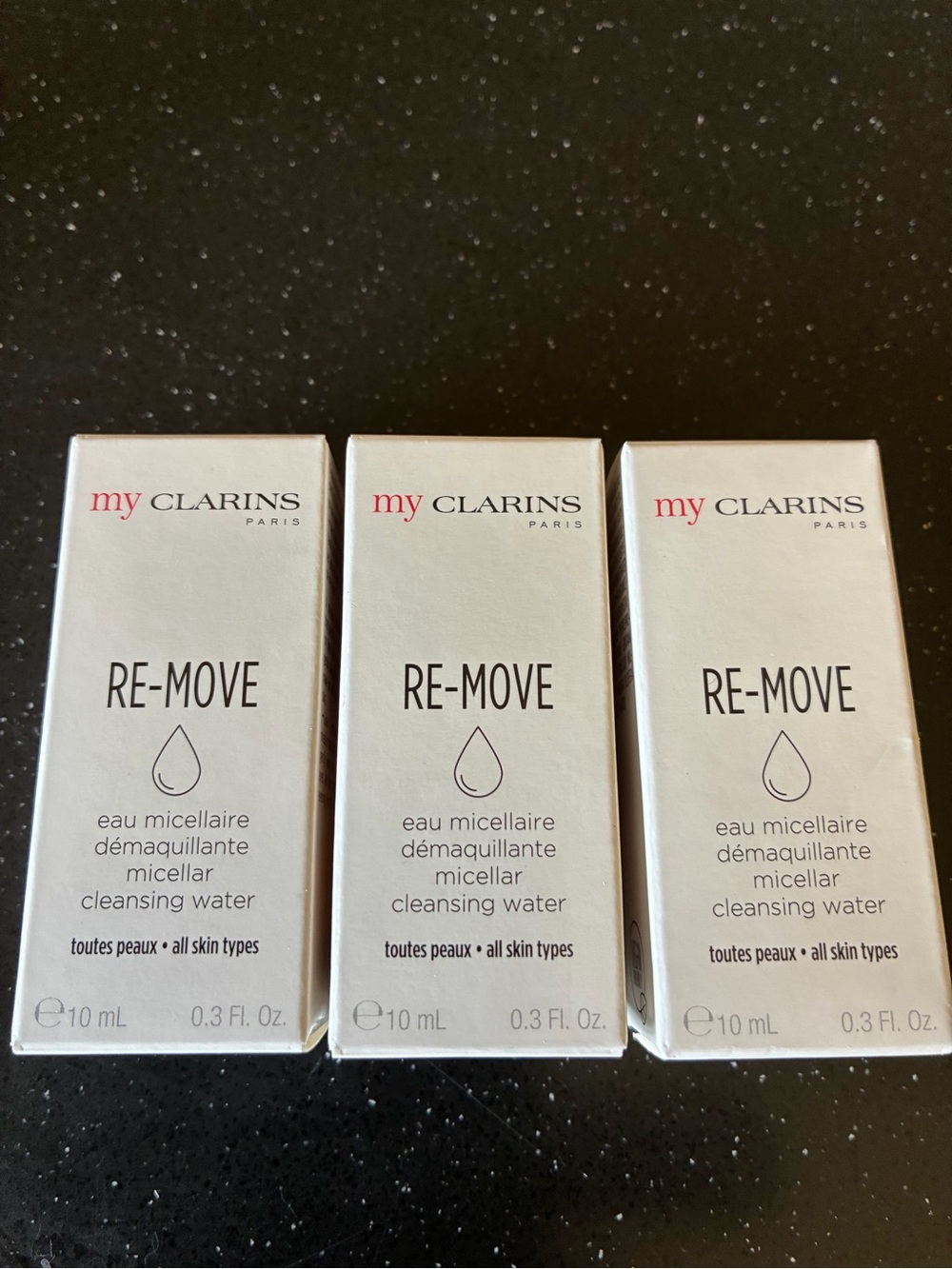 Clarins RE-MOVE Micellar Cleansing Water Trio — White with Pink Logo